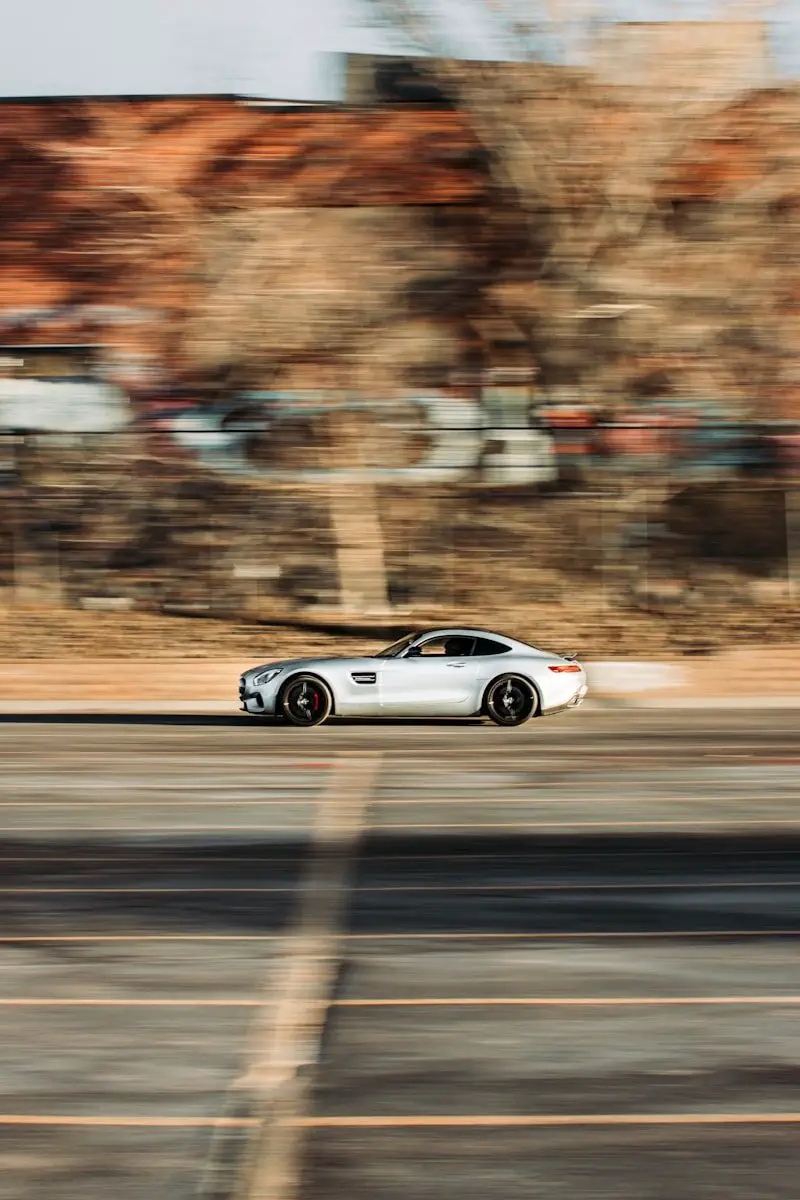 silver coupe on road during daytime